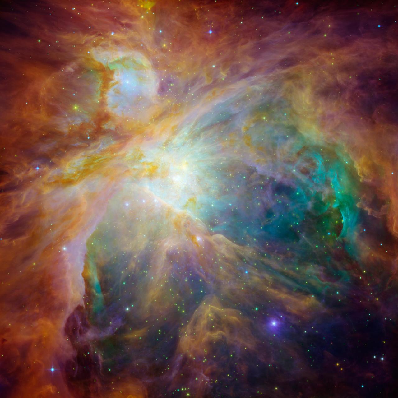 ハッブル宇宙望遠鏡とスピッツァー宇宙望遠鏡で捉えたオリオン大星雲の合成画像。