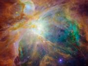 ハッブル宇宙望遠鏡とスピッツァー宇宙望遠鏡で捉えたオリオン大星雲の合成画像。