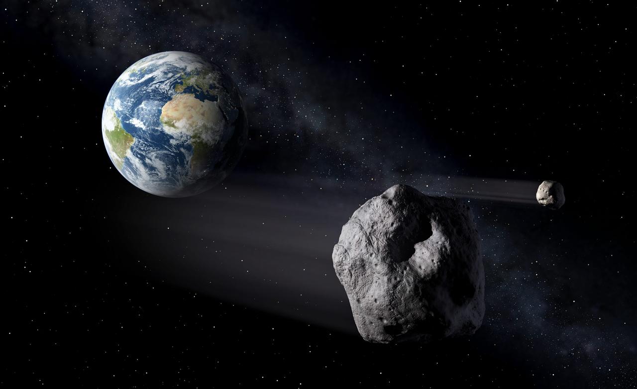 地球の近くを通過する小惑星の想像図。