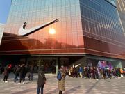 Customers lined up outside the Nike flagship store on the opening day at Wangfujing Street on January 20, 2021 in Beijing, China.