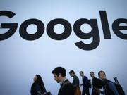 People walk past the Google pavilion at CES 2020 at the Las Vegas Convention Center on January 8, 2020 in Las Vegas, Nevada.