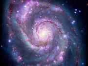 チャンドラ望遠鏡のX線観測データとNASAハッブル宇宙望遠鏡の可視光画像を合成した銀河M51の画像。
