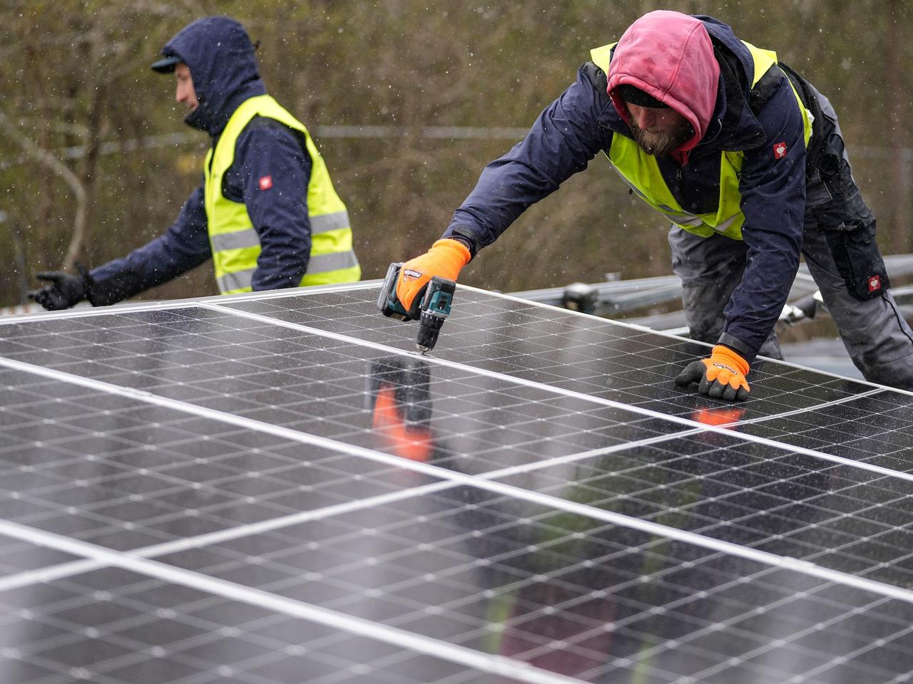 Solar panels are installed at a floating photovoltaic plant on a lake in Haltern, Germany, Friday, April 1, 2022.