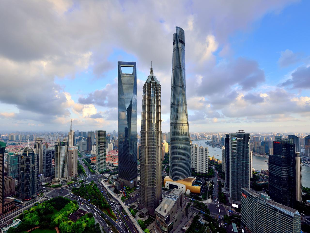 Shanghai Tower, Jin Mao Tower, and Shanghai World Financial Center stand in a cluster in Lujiazui, Shanghai's financial district