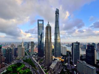 Shanghai Tower, Jin Mao Tower, and Shanghai World Financial Center stand in a cluster in Lujiazui, Shanghai's financial district