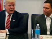 Then-President Donald Trump sits with PayPal co-founder and former Facebook board member Peter Thiel, during a meeting with technology leaders at Trump Tower in New York City on December 14, 2016.