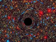 銀河の中心にある超大質量ブラックホールをコンピュータでシミュレーションした画像。