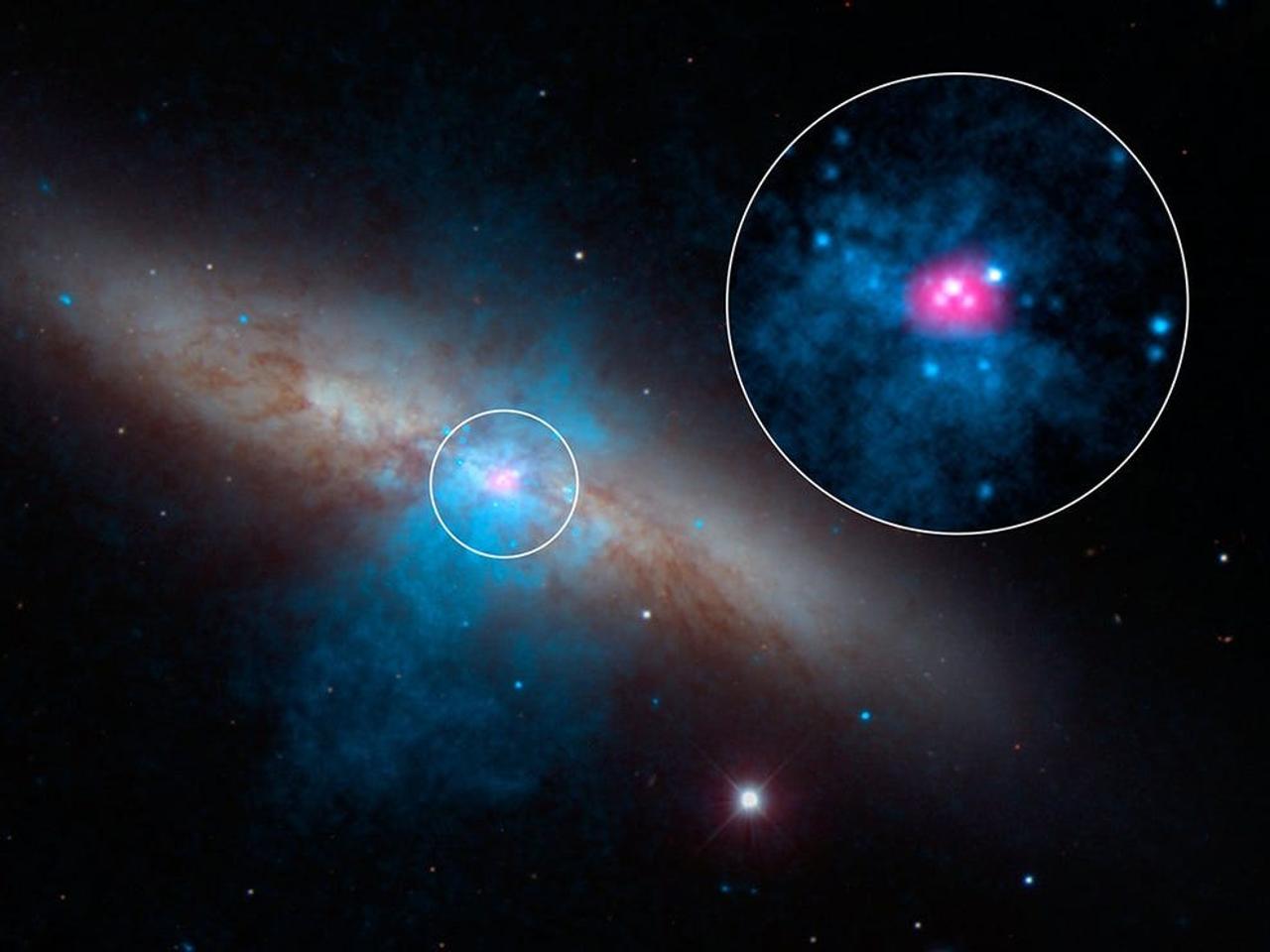 超高輝度X線源｢M82 X-2｣（円で囲まれた部分）は、銀河M82の中に存在する。この画像は、可視光で撮影されたデータを擬似カラーで着色している。