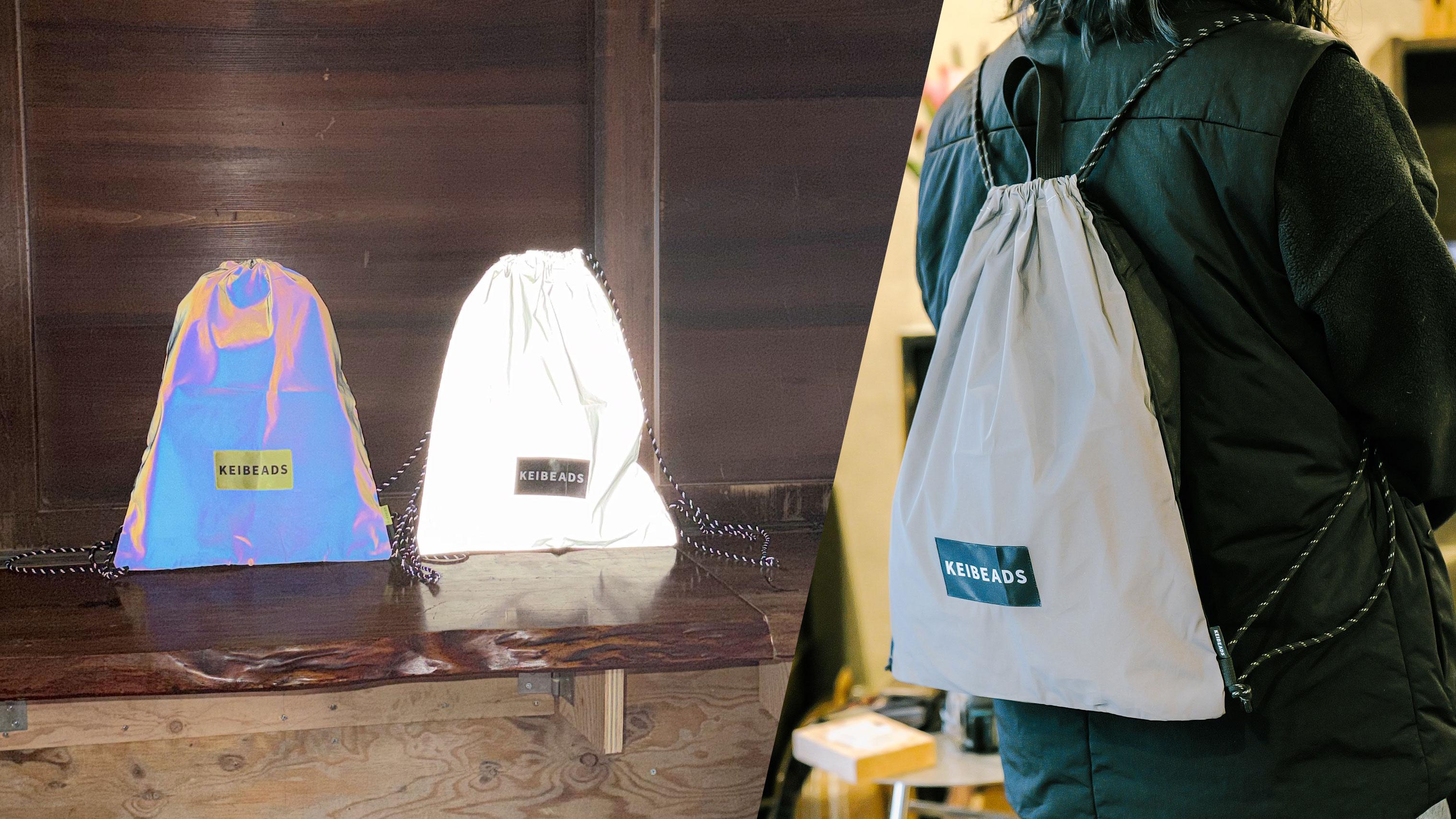 ライトが当たるとめちゃくちゃ光る。特許生地のナップサックで夜道もご安全に