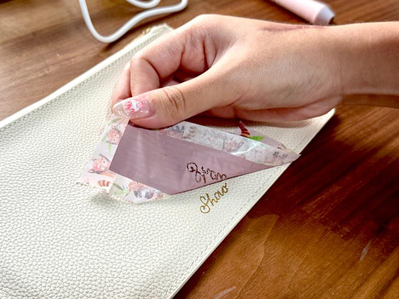 Soo hand-foiling a purse for a corporate client.