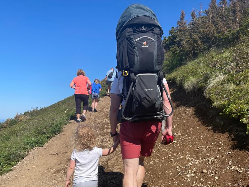 Dr. Jake Kelly hiking with his young kids