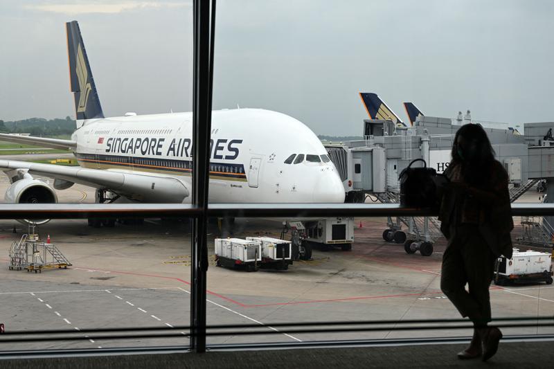 A Singapore Airlines plane parked on the tarmac at Singapore Changi Airport.
