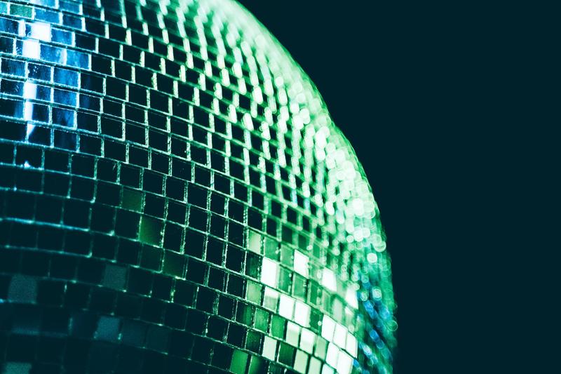 A green disco ball, like the one used on the Spotify app