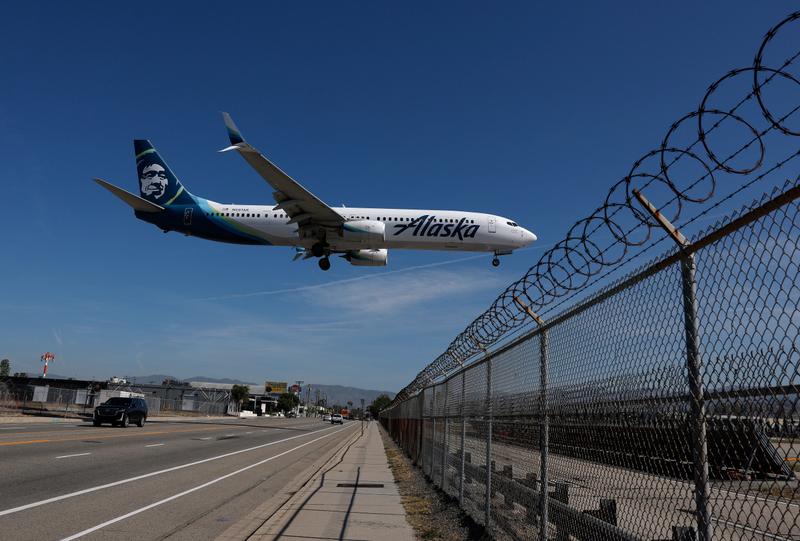 An Alaska Airlines plane lands at Hollywood Burbank Airport on April 20, 2026 in Burbank, California