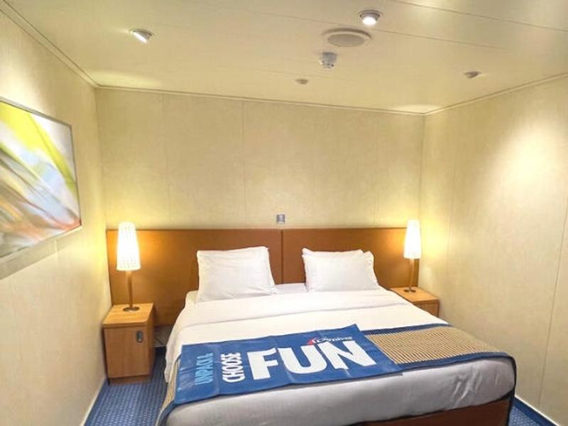 A interior shot of the cruise ship cabin and a selfie in front of the cruise ship shot.