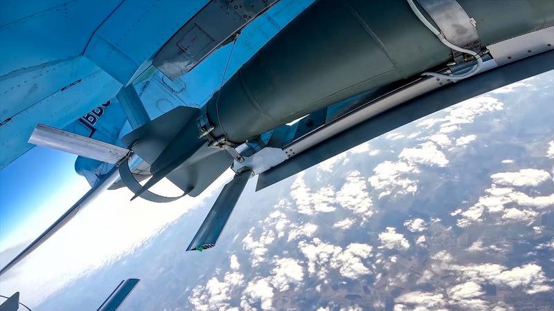 The underside of a Su-34, showing a FAB-500 with a UMPK kit.