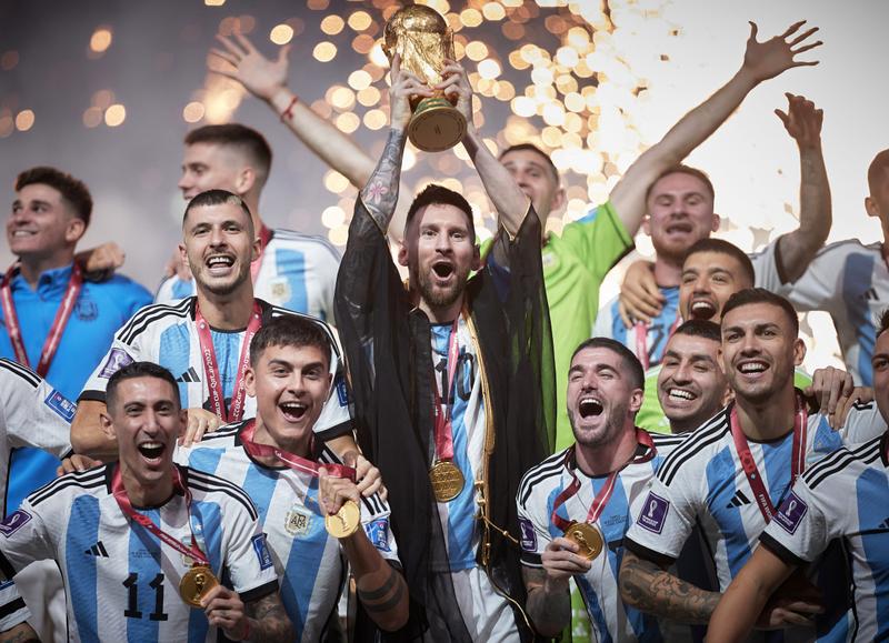 LUSAIL CITY, QATAR - DECEMBER 18: Lionel Messi of Argentina lifts the FIFA World Cup Qatar 2022 Winner's Trophy during the FIFA World Cup Qatar 2022 Final match between Argentina and France at Lusail Stadium on December 18, 2022 in Lusail City, Qatar. (Photo by Julian Finney/Getty Images)