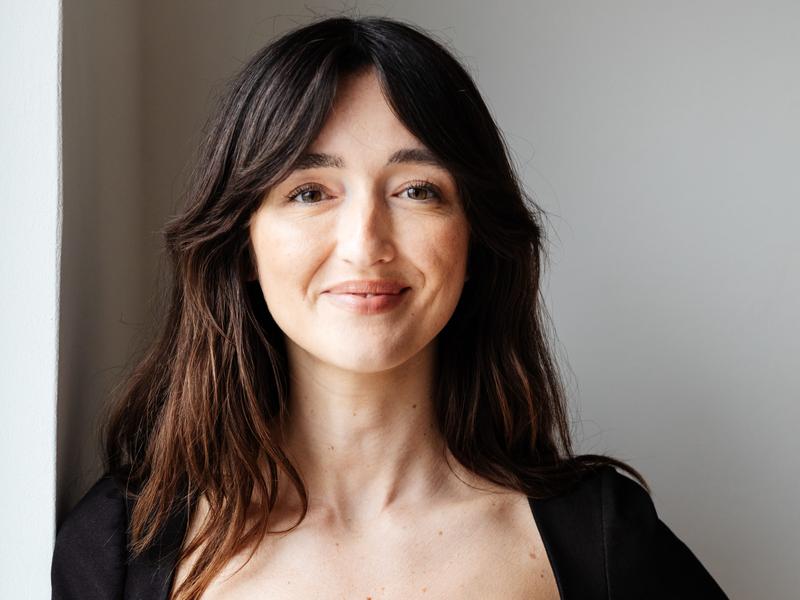 A woman with brown hair.