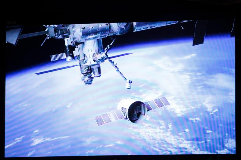 A slide of the SpaceX Dragon reaching the International Space Station.