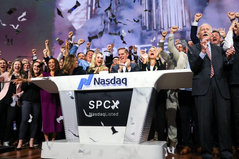 SpaceX Chief Financial Officer Bret Johnsenin the center and President Gwynne Shotwell to his right celebrate as they ring the opening bell at the Nasdaq MarketSite to celebrate the launch of SpaceX's initial public offering.