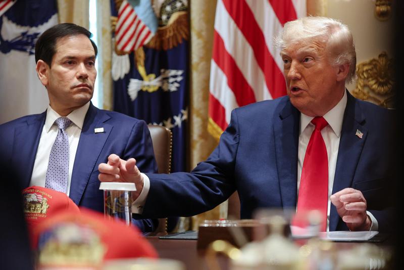 President Donald Trump speaks as U.S. Secretary of State Marco Rubio (L) listens during a Cabinet meeting in the Cabinet Room of the White House.