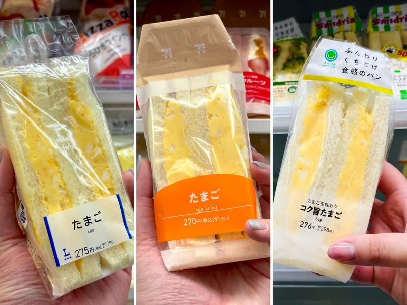 Three packaged egg salad sandwiches are held side by side in a convenience store sandwich display.