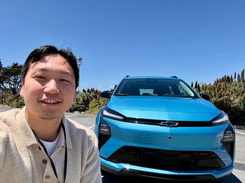 A man and a Chevy Bolt.